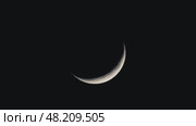 Night Sky with Waxing Crescent Moon and Visible Craters. Стоковое видео, видеограф Dzmitry Astapkovich / Фотобанк Лори