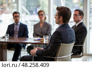 Man is interviewed by a commission when applying for a job. Стоковое AI-изображение, AI-художник Дмитрий Киселёв / Фотобанк Лори