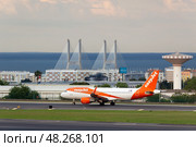LISBON, PORTUGAL - MAY 1, 2025: EasyJet Airplane Taxiing at the Airport. Редакционное фото, фотограф Максим Забаровский / Фотобанк Лори