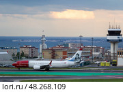 LISBON, PORTUGAL - MAY 1, 2025: Norwegian Airplane Taxiing at the Airport. Редакционное фото, фотограф Максим Забаровский / Фотобанк Лори