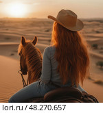 A woman with long red hair is riding a horse in a desert. Стоковое AI-изображение, AI-художник Ярославский Максим / Фотобанк Лори