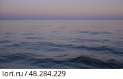 Tranquil Ocean Sunset View Over Calm Waters in Serene Location. Стоковое AI-видео, аниматор Юлия Гапеенко / Фотобанк Лори