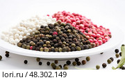 seasing peppercorns on white. Стоковое AI-изображение, AI-художник Vectorwin / Фотобанк Лори