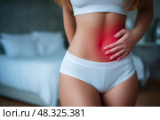Menstrual pain, woman with stomachache suffering from pms, endometriosis, cystitis and other diseases of the urinary system. Стоковое AI-изображение, AI-художник Станислав Тарко / Фотобанк Лори
