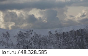 Mountains Snow Clouds Dramatic Alpine landscape under stormy skies. Стоковое видео, видеограф svetograph / Фотобанк Лори
