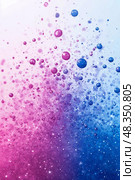 Vibrant bubbles in various sizes float and scatter, creating a dynamic gradient transition from pink to blue, evoking a sense of movement and energy. Стоковое AI-изображение, AI-художник Данила Большаков / Фотобанк Лори