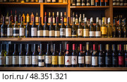 shelves wine bottle shop ai generated. Стоковое AI-изображение, AI-художник Vectorwin / Фотобанк Лори
