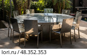 outdoor metallic table ai generated. Стоковое AI-изображение, AI-художник Vectorwin / Фотобанк Лори