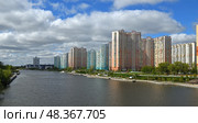 Picturesque Embankment and new modern residential area of Pavshinsky floodplain on Moscow River. Редакционное фото, фотограф Валерия Попова / Фотобанк Лори