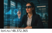 A professional in a business suit, focused on analyzing data and graphs that are displayed as a hologram. Стоковое AI-видео, аниматор Пинхасова Елена Александровна / Фотобанк Лори