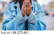A plea for serenity: hands clasped in prayer, seeking tranquility. Стоковое AI-изображение, AI-художник Данила Большаков / Фотобанк Лори