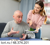 Portrait of a surprised man, which a woman brought a plate of spinach. Стоковое фото, фотограф Яков Филимонов / Фотобанк Лори