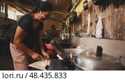 Cooking in a Beautiful Rustic Kitchen A Journey of Culinary Craftsmanship and Passion. Стоковое видео, видеограф Евдокимов Максим / Фотобанк Лори
