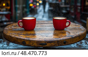 Winter Warmth: Two Coffees on a Cozy Cafe Table in the Snow. Стоковое AI-изображение, AI-художник Данила Большаков / Фотобанк Лори