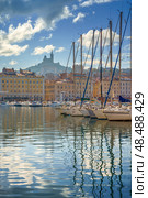 The Old Port Vieux Port of Marseille with Basilique Notre-Dame de la Garde blurred in the fog and the yauchts (2018 год). Стоковое фото, фотограф Сергей Богомяко / Фотобанк Лори