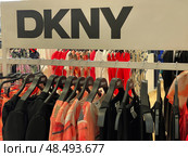 DKNY clothing rack inside Spanish department store. Редакционное фото, фотограф Данил Руденко / Фотобанк Лори