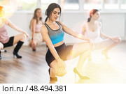 Young female dancer in high heels practicing jazz-funk in studio. Стоковое фото, фотограф Яков Филимонов / Фотобанк Лори