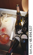 Russia, St.Petersburg, 24 April 2025: Several bottles of champagne brand Bonnet-Ponson are cooled in a niche with ice in the restaurant, local lighting, wine cabinet, decanters for sparkling wine. Редакционное видео, видеограф Vladimir Drozdin / Фотобанк Лори