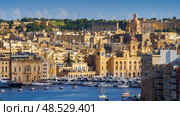 VALLETTA, MALTA - NOVEMBER 12, 2018 - The Grand Harbor Tricity bay, Birgu and Senglea islands with ships and boats in the port. Стоковое фото, фотограф Сергей Богомяко / Фотобанк Лори
