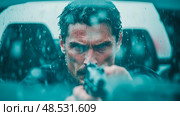 A Ruthless Vigilante: Intense Man Aims Gun in Pouring Rain, Ready for Retribution. Стоковое AI-изображение, AI-художник Данила Большаков / Фотобанк Лори