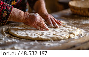 Elderly woman is energetically kneading dough on a wooden table, preparing it for baking. Her hands work the dough as flour dusts the surface. Стоковое AI-изображение, AI-художник Данила Большаков / Фотобанк Лори