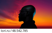 suncontrast black man hair silhouette ai generated. Стоковое AI-изображение, AI-художник Vectorwin / Фотобанк Лори