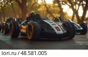 Go-karts featuring streamlined designs await their drivers in a sunlit park, creating an exciting atmosphere for racing enthusiasts to enjoy. Стоковое AI-изображение, AI-художник Данила Большаков / Фотобанк Лори