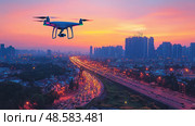 A drone hovers above a busy highway as the sun sets, illuminating the city skyline with warm colors and capturing the hustle of evening commutes. Стоковое AI-изображение, AI-художник Данила Большаков / Фотобанк Лори