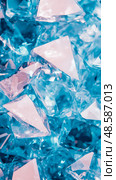 A pile of blue crystal treasures, raw beauty and mineral wealth of nature, a scattering of gem material. Стоковое AI-изображение, AI-художник Данила Большаков / Фотобанк Лори