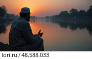 Mourner Whispers Prayers for Martyrs at Twilight by a Serene River, Reflecting the Essence of Memorials and Meditation. Стоковое AI-изображение, AI-художник Sergey Grishin / Фотобанк Лори