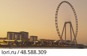 UAE, Dubai, 21 November 2024: The famous largest observation wheel The Eye of Dubai at sunset - Ain Dubai, island Bluewaters. Редакционное видео, видеограф Vladimir Drozdin / Фотобанк Лори