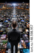 A man stands in front of a cityscape with many different images. Стоковое AI-изображение, AI-художник Ярославский Максим / Фотобанк Лори
