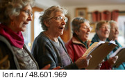 Group of older women standing together, singing in harmony as part of a choir performance. Стоковое AI-изображение, AI-художник Данила Большаков / Фотобанк Лори