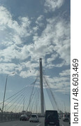 SAINT PETERSBURG, RUSSIA - May 13, 2025: Vertical video of traffic on Western High-Speed ​​Diameter WHSD and beautiful cable-stayed bridge against the backdrop of blue sky across the Petrovsky fairway. Редакционное видео, видеограф Виктория Катьянова / Фотобанк Лори