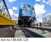 The first subway car on the background of the blue sky at the exhibition dedicated to the 90th anniversary of the Moscow metro. Russia. Moscow. 15.05.2025. Редакционное фото, фотограф Ярославский Максим / Фотобанк Лори
