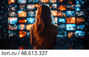 A young woman stands in front of multiple screens, mesmerized by the colorful images and scenes flashing in a contemporary environment. Стоковое AI-изображение, AI-художник Данила Большаков / Фотобанк Лори