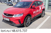 Geely BelGee X50 vehicle next the showroom of official dealer. Chinese automobile manufacturer. Редакционное видео, видеограф FotograFF / Фотобанк Лори