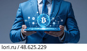 Businessman in blue suit holds tablet displaying Bitcoin cryptocurrency network concept with digital connections. Стоковое AI-изображение, AI-художник Сергей Толмачёв / Фотобанк Лори