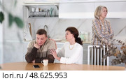 Family quarrel, adult woman calming man, all are upset and dissatisfied. Family quarrel, adult woman calming man. Стоковое видео, видеограф Яков Филимонов / Фотобанк Лори