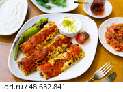 Just cooked beyti sarma served on table. Стоковое фото, фотограф Яков Филимонов / Фотобанк Лори
