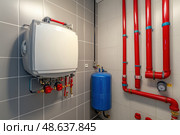 House heating system equipment. Pipelines. Basement mechanical room with condensing water heater, storage tank, plumbing systems. Plumbing service. Pipeline in boiler room. Pipes. Wall installation. Стоковое AI-изображение, AI-художник Марина Демидюк / Фотобанк Лори