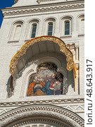 Fragments of facade decor with stucco and mosaics of the St. Nicholas Cathedral in Kronstadt. Icon of the Holy Trinity. Стоковое фото, фотограф Оксана Медведева / Фотобанк Лори