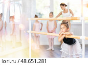 Rest between rehearsals - little ballerina rests during break between ballet lessons. Стоковое фото, фотограф Яков Филимонов / Фотобанк Лори
