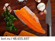 Raw trout fillet with greens and spices. Стоковое фото, фотограф Яков Филимонов / Фотобанк Лори