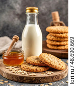 There is fresh milk, oatmeal cookies and honey on the table. Morning breakfast. Still life. Стоковое AI-изображение, AI-художник Сергей Елизарьев / Фотобанк Лори