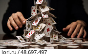 concentration house of playing cards ai generated. Стоковое AI-изображение, AI-художник Vectorwin / Фотобанк Лори