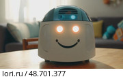 Meet Robot, a friendly robot with a smiling face designed to interact with users and create engaging gaming experiences for both kids and adults. Стоковое AI-видео, аниматор ALLA YURTAYEVA / Фотобанк Лори