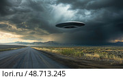 A hovering unidentified flying object is spotted over a desolate road, creating an eerie atmosphere as storm clouds gather. Стоковое AI-изображение, AI-художник Данила Большаков / Фотобанк Лори