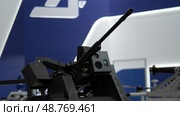 Weaponry Displays Showcasing Advanced Gun Technology in a Modern Military Exhibition Held in a Convention Center During the Latest Defense Conference. Стоковое фото, фотограф Громов Александр / Фотобанк Лори