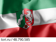 3D illustration flag of North Rhine-Westphalia is a region of Ge. Стоковое фото, фотограф Максим Гребешков / Фотобанк Лори
